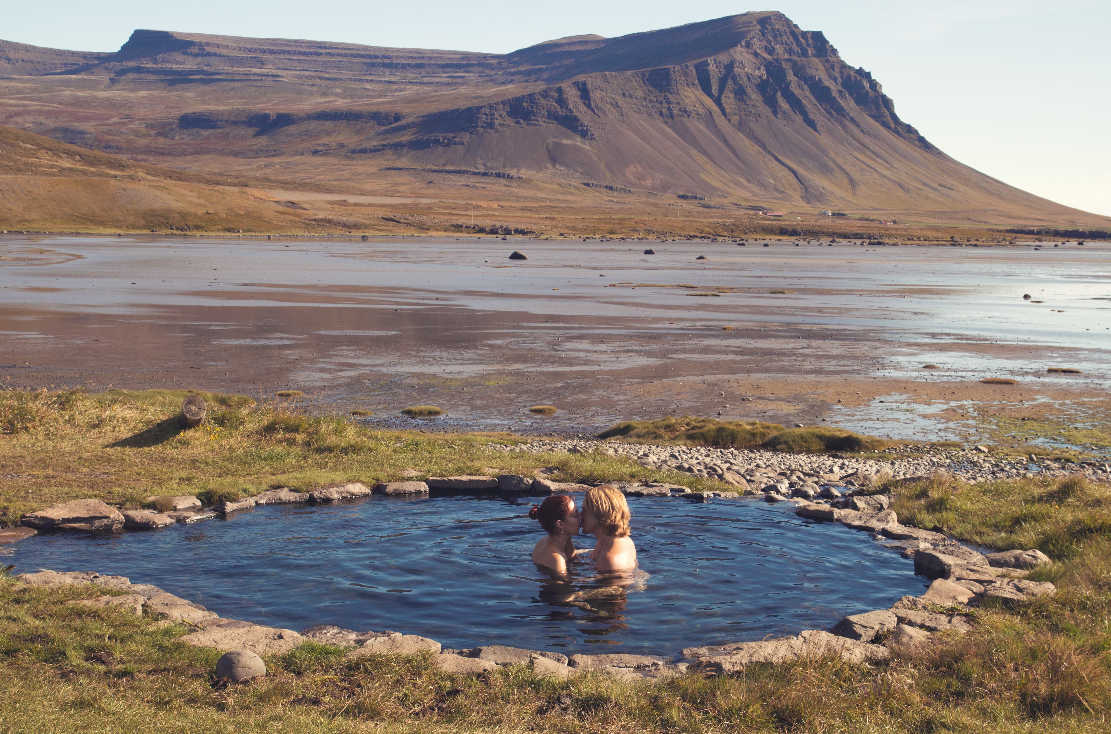 Photography created by ©Radoslav Cajkovic www.radocation.com Romantic couple enjoying and relaxing in geothermal bath in the middle of wild nature