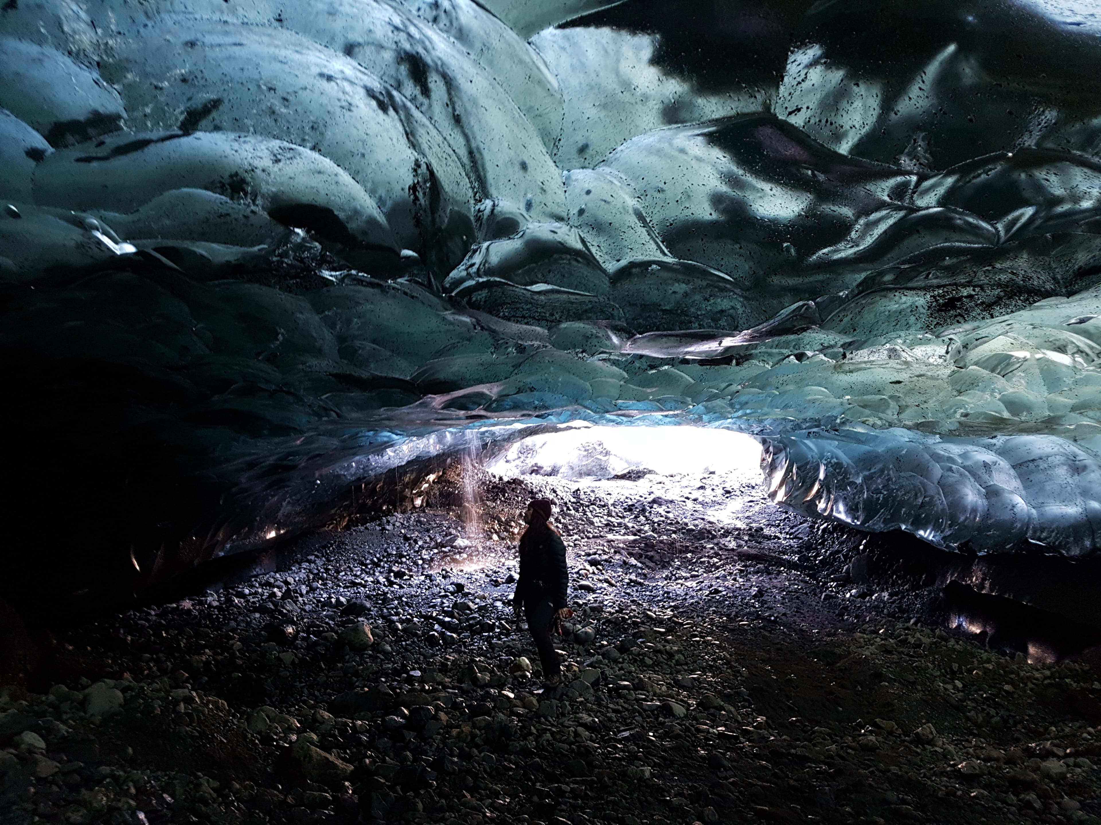 man-exploring-wonderfull-ice-cave-iceland-vatnajokull