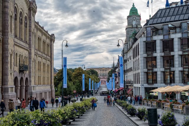 Oslo's main street Karl Johans Gate with the Royal Palace in the background, Norway Oslo main street Karl Johans Gate with the Royal Palace in background, Norway