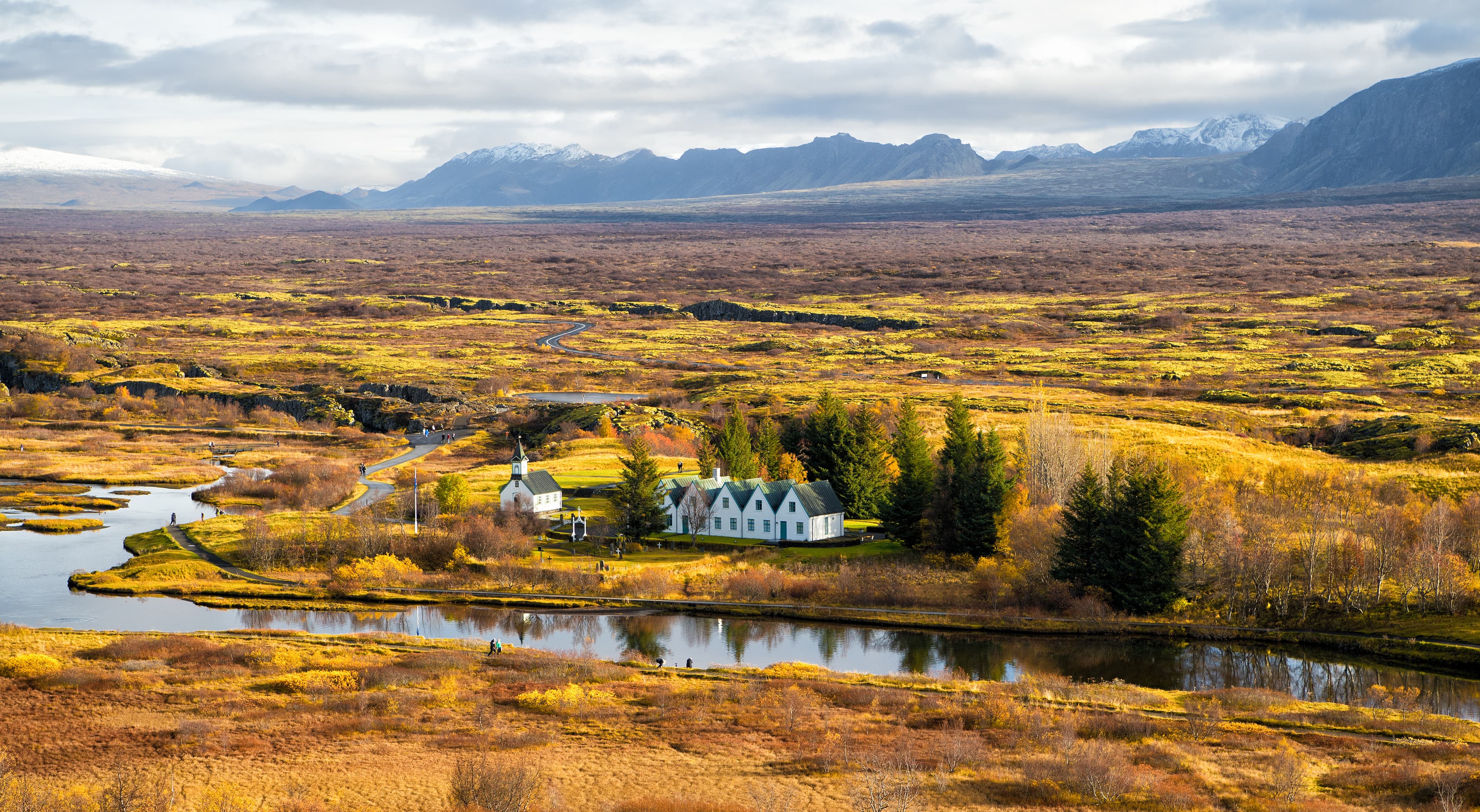 plain thingvellir national park in reykjavik enters to the iceland golden circle. plain thingvellir national park in reykjavik enters to the iceland golden circle. countryside with river, church, houses on mountain landscape in Iceland. best vacations. perfect morning.
