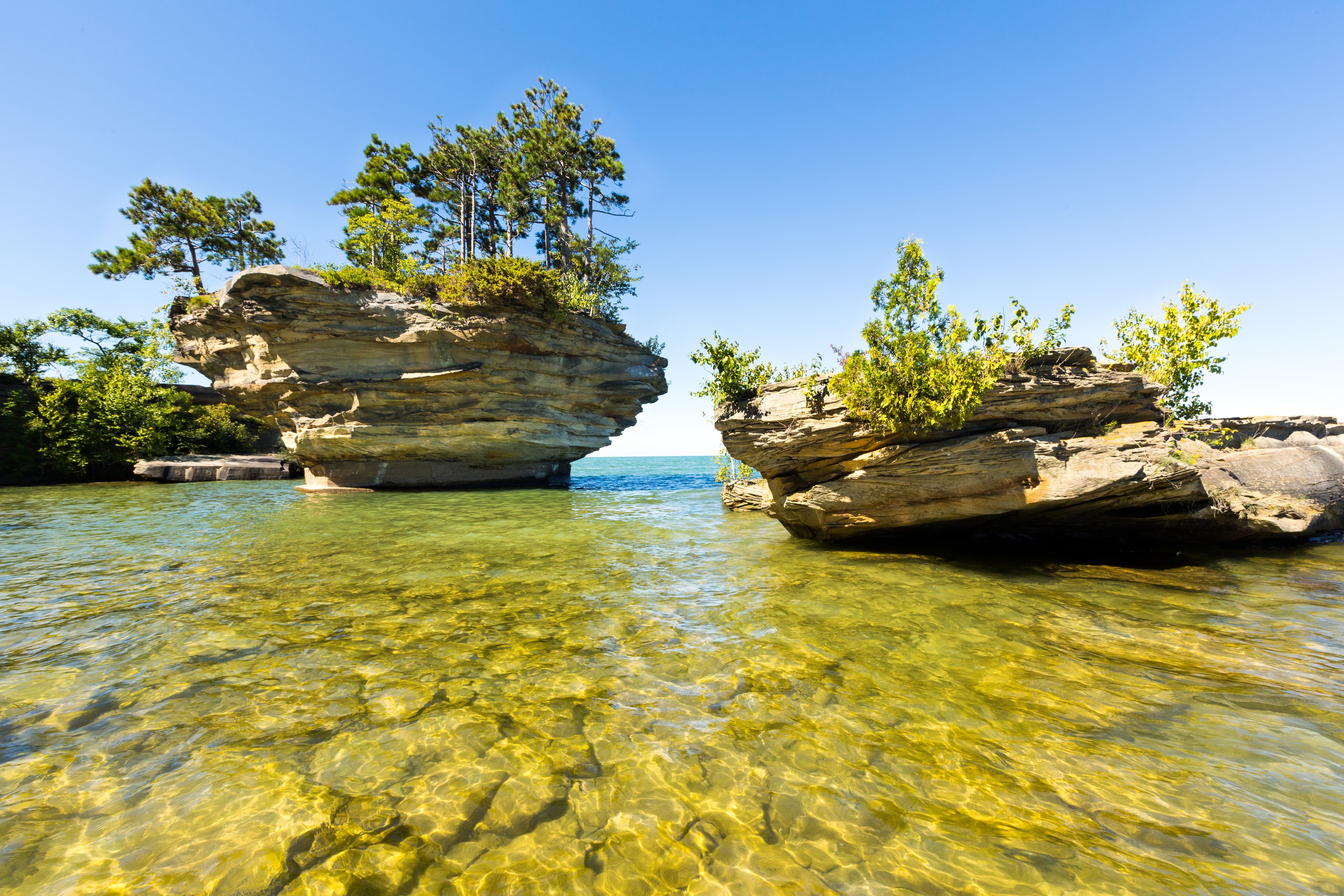 Turnip Rock on Lake Huron in Port Austin Michigan. An underwater view shows rocks under the clear surface of the water Turnip Rock on Lake Huron, near Port Austin Michigan