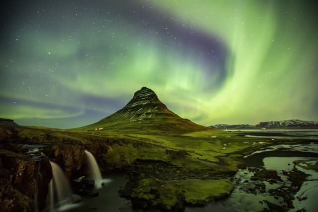 Northern Light Aurora borealis at Kirkjufell Iceland with fully start in the sky. Northern Light Aurora borealis at Kirkjufell Iceland with fully start in the sky