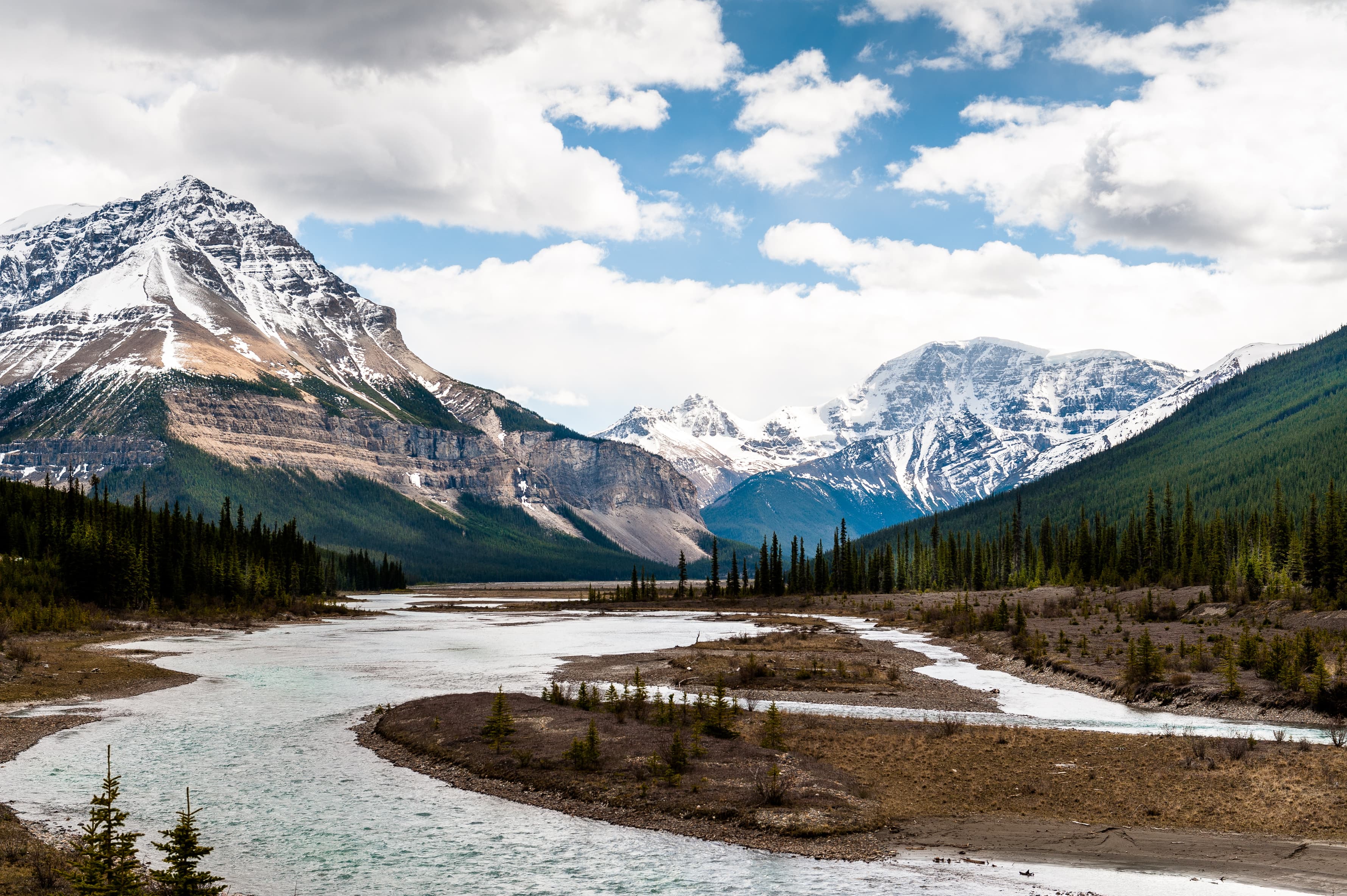 Athabasca River close view with  Columbia Icefield in background in Jasper National Park, Alberta,Canada Athabasca River close view with  Columbia Icefield