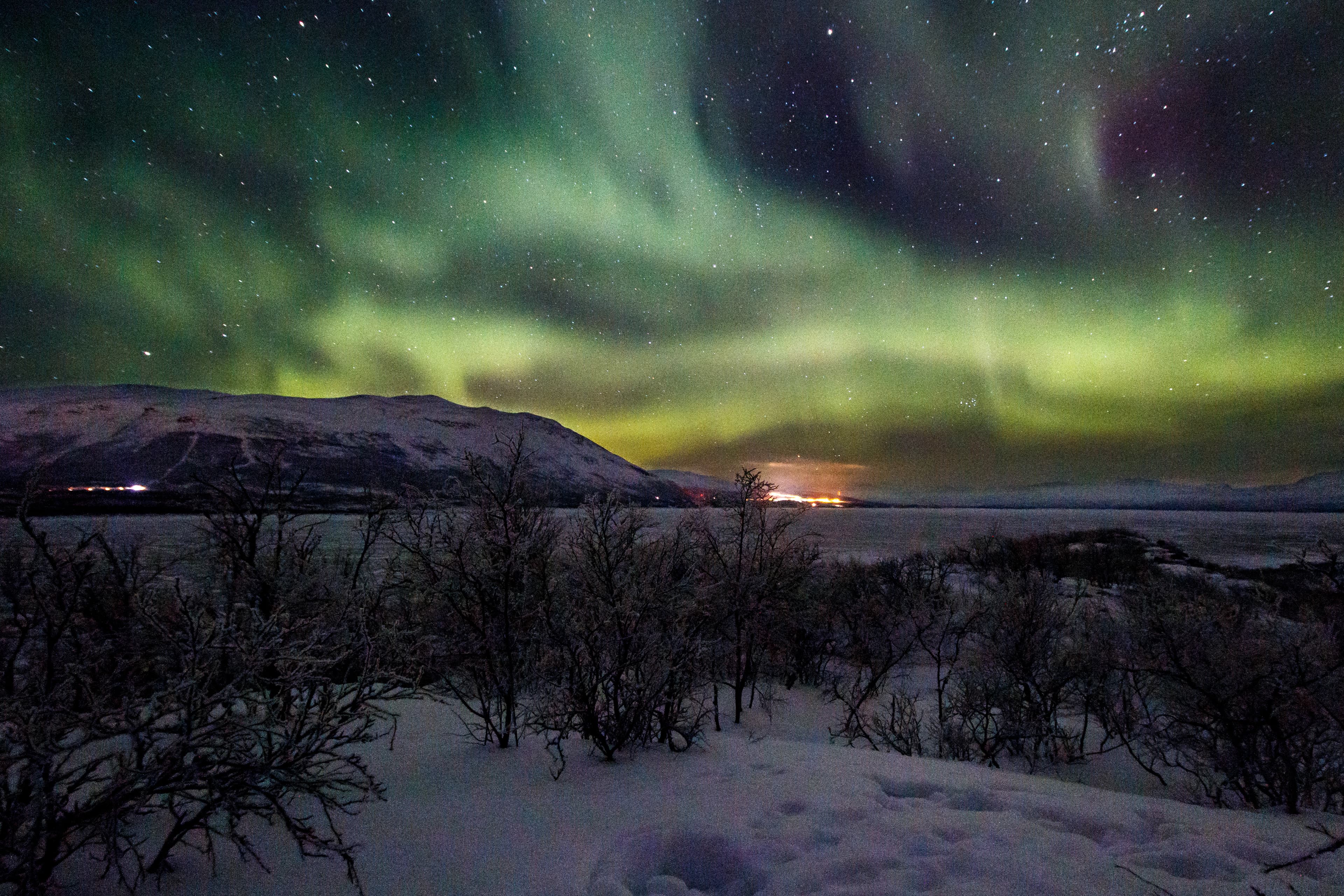 Beautiful aurora borealis over mountain at abisko national park, Lapland, Sweden, Northern lights