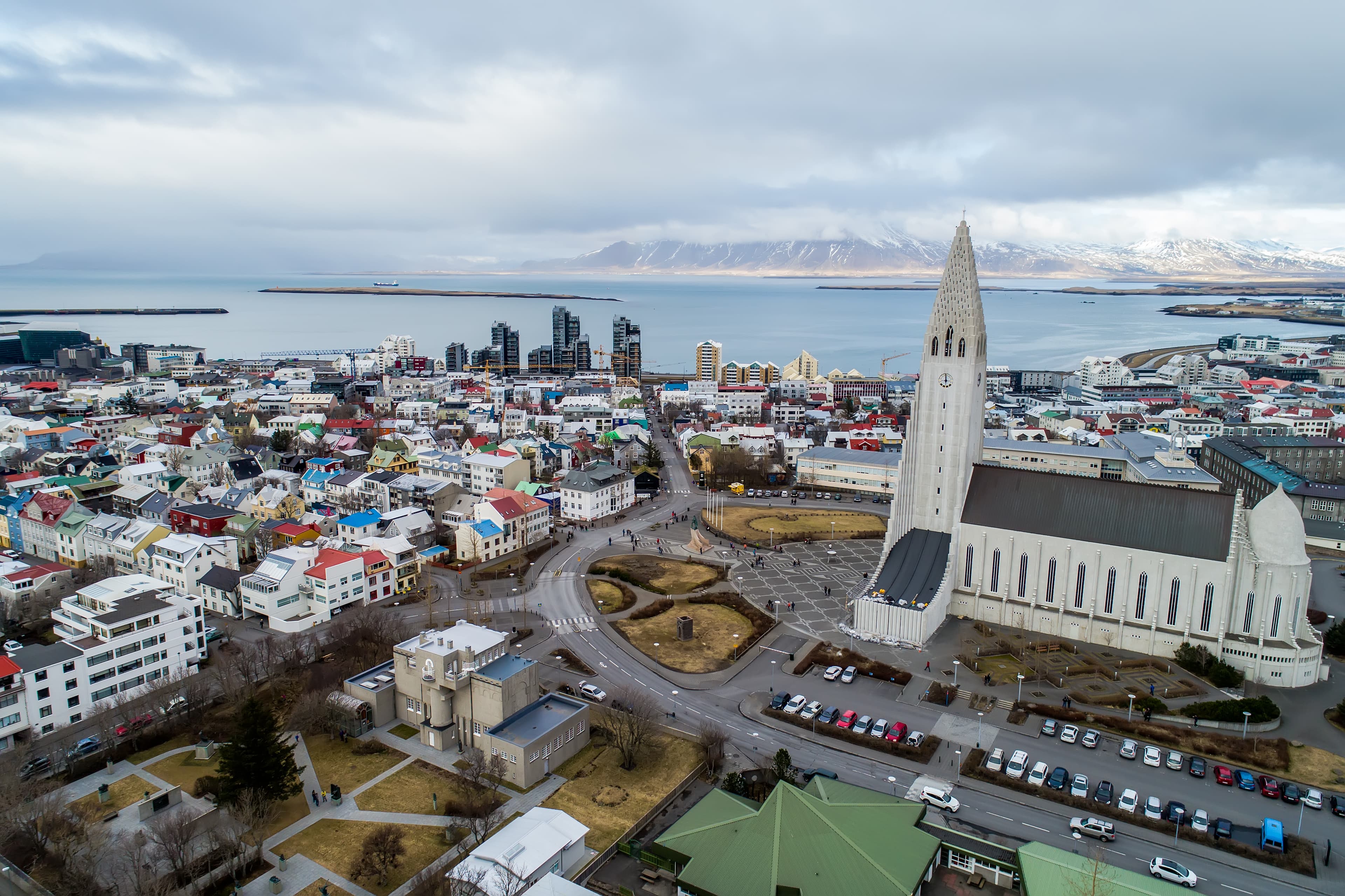Aerial view of famous Hallgrimskirkja Cathedral and the city of Reykjavik in Iceland. Image taken with action drone camera Aerial view of famous Hallgrimskirkja Cathedral and the city of Reykjavik in Iceland