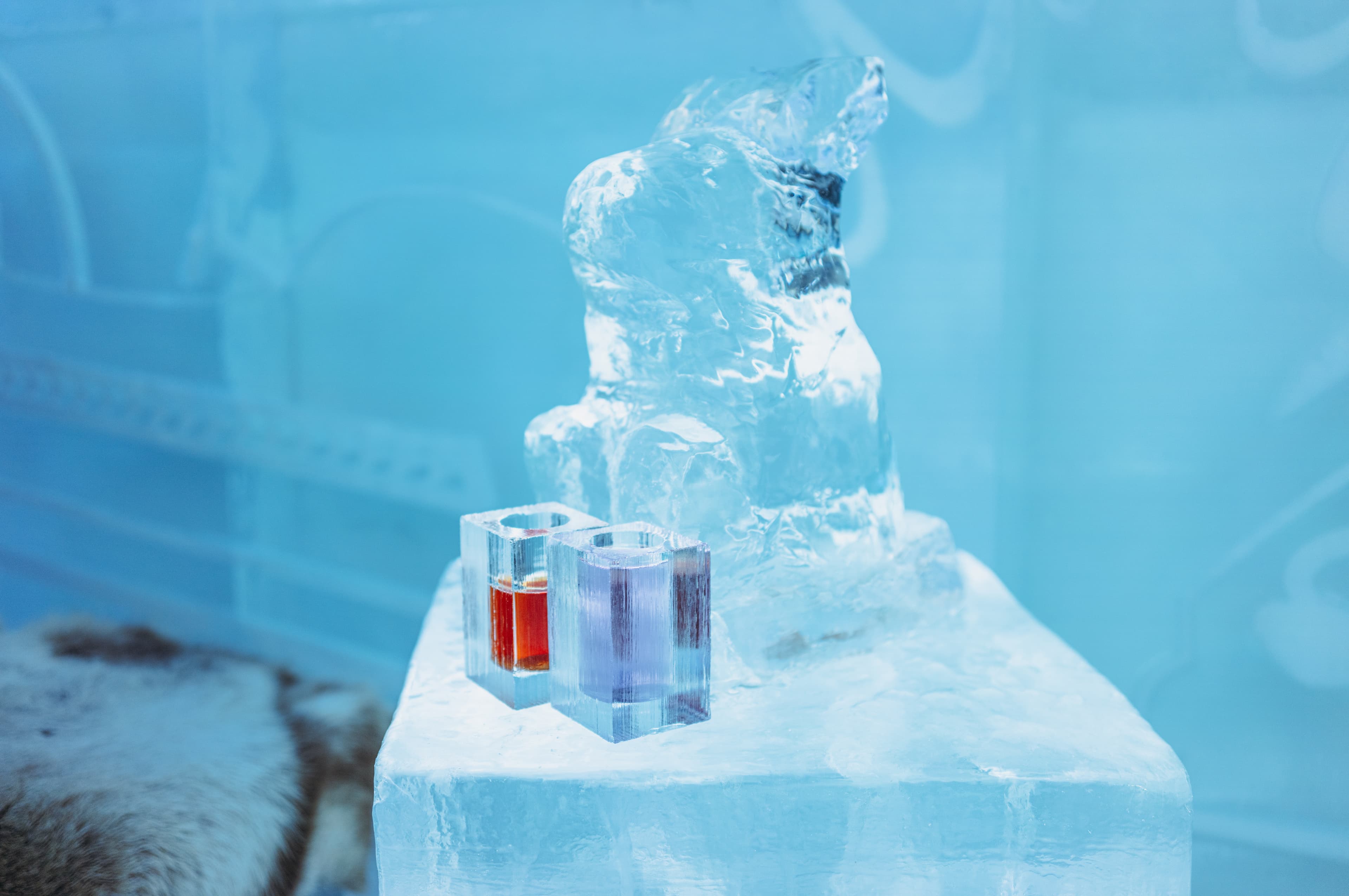 Jukkasjarvi, Sweden - January 04, 2022 : Ice glasses and furnitures at Ice Hotel in Jukkasjarvi, Sweden Jukkasjarvi, Sweden - January 04, 2022 : Ice glasses and furnitures in the Ice Hotel in Jukkasjarvi near Kiruna Sweden