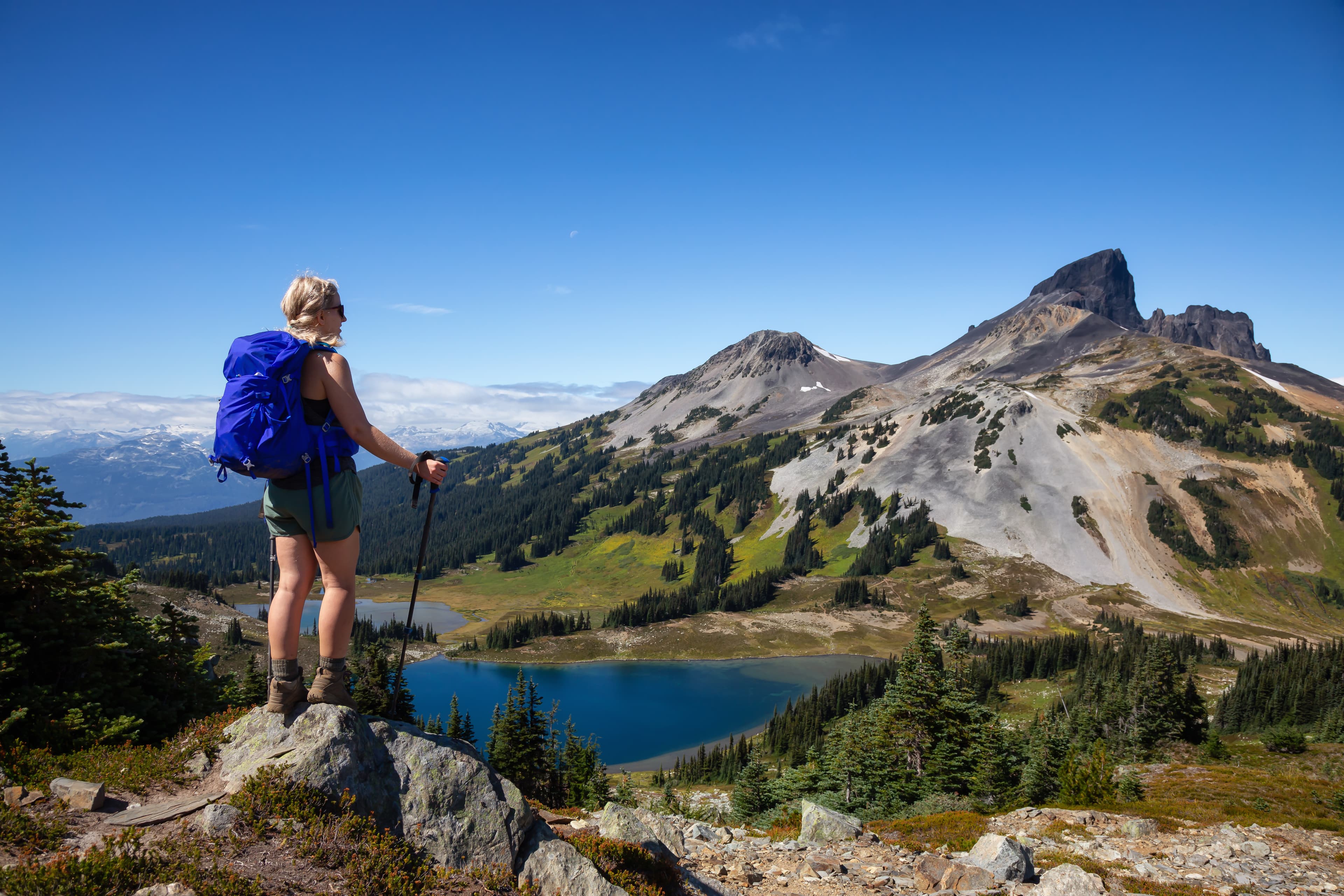 Adventurous girl enjoying the beautiful Canadian Mountain Landscape during a vibrant summer day. Taken in Garibaldi Provincial Park, located near Whister and Squamish, North of Vancouver, BC, Canada. Adventurous girl enjoying the beautiful Canadian Mountain Landscape during a vibrant summer day. Taken in Garibaldi Provincial Park, located near Whister and Squamish, North of Vancouver, BC, Canada.