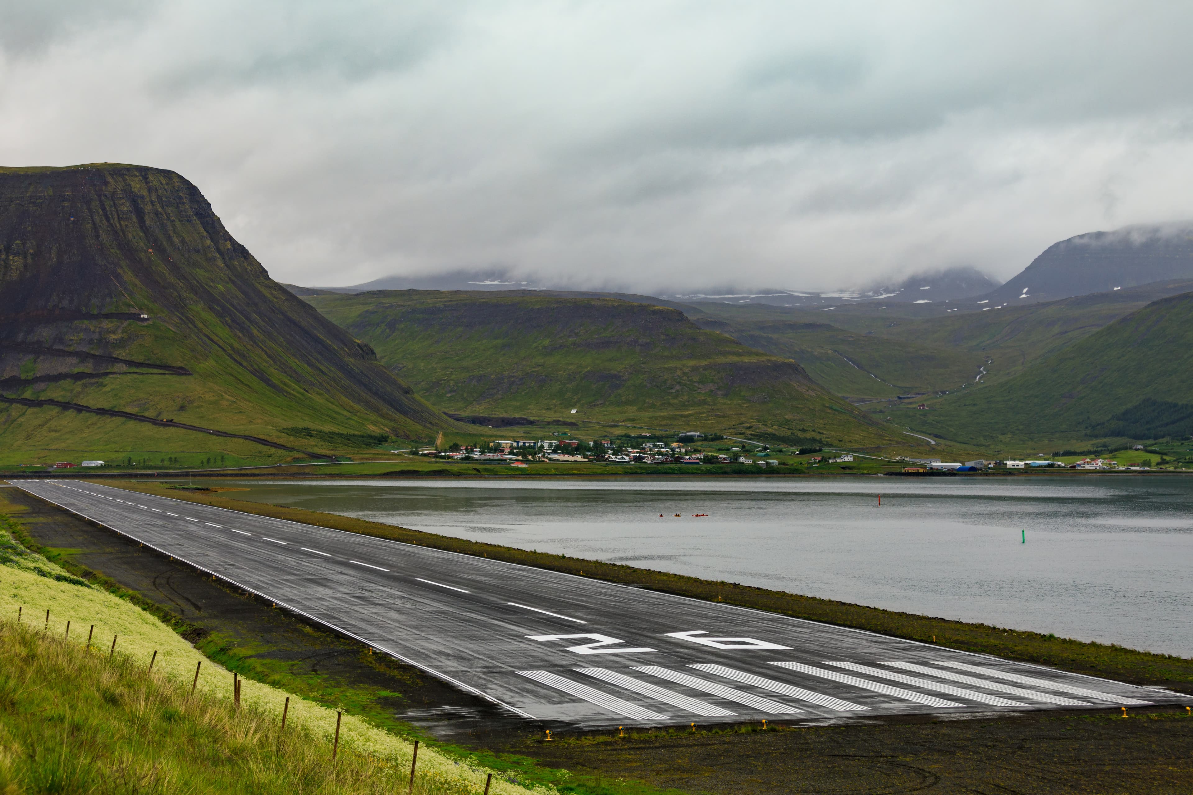 Airport, runway and city of isafjordur on the wesfjords in nothern iceland Airport, runway of isafjordur on the wesfjords
