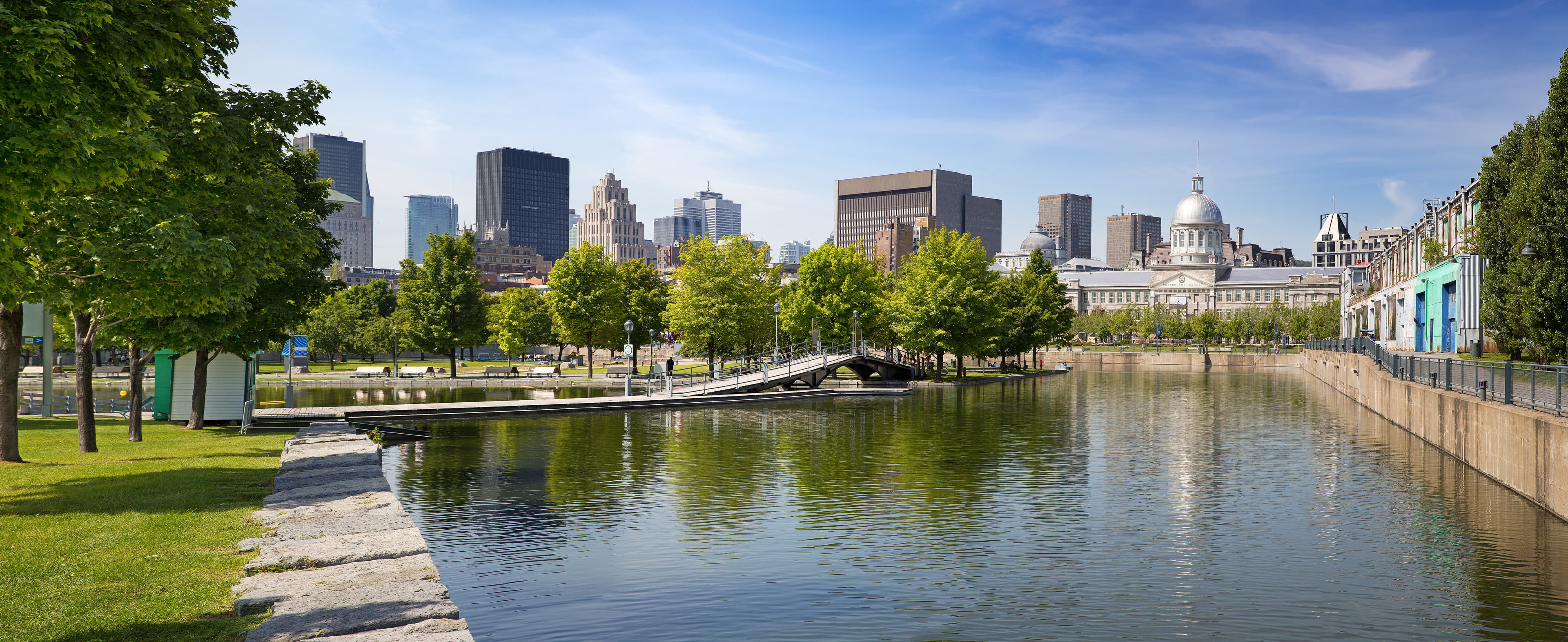 Summer panorama of downtown Montreal viewed from the park, showing the old Bonsecours Market building, which was the public city market for over 100 years. Underground City and Downtown Montreal 04