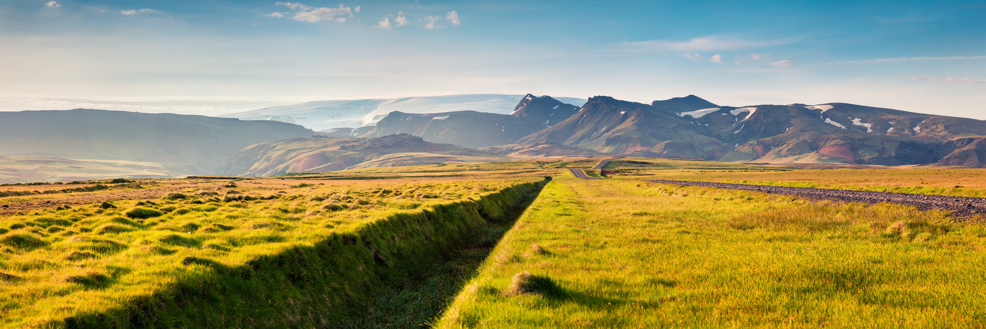 Panorama of the typical icelandic landscape with volcanic mountains. colorful summer scene in the south coast of Iceland, Europe. Artistic style post processed photo.. Panorama of the typical icelandic landscape with volcanic mountains