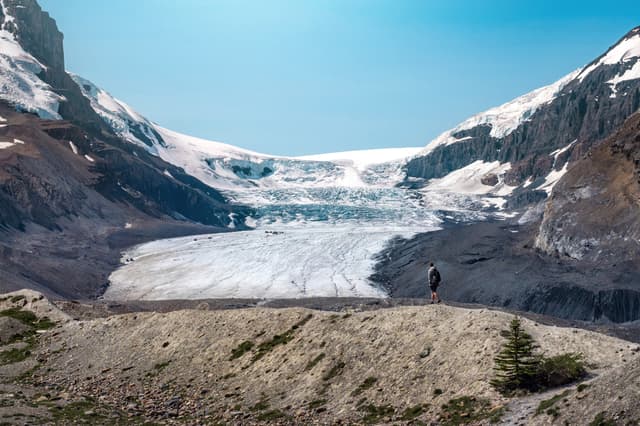 Athabasca Glacier during summer in Jasper National Park, Canadian Rockies, Alberta, Canada.  Panoramic view of Columbia Icefields Parkway