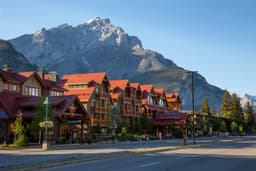 Banff, Alberta, Canada - June 17, 2018: Beautiful view of Banff City during a vibrant summer day. Banff, Alberta, Canada - June 17, 2018: Beautiful view of Banff City during a vibrant summer day.