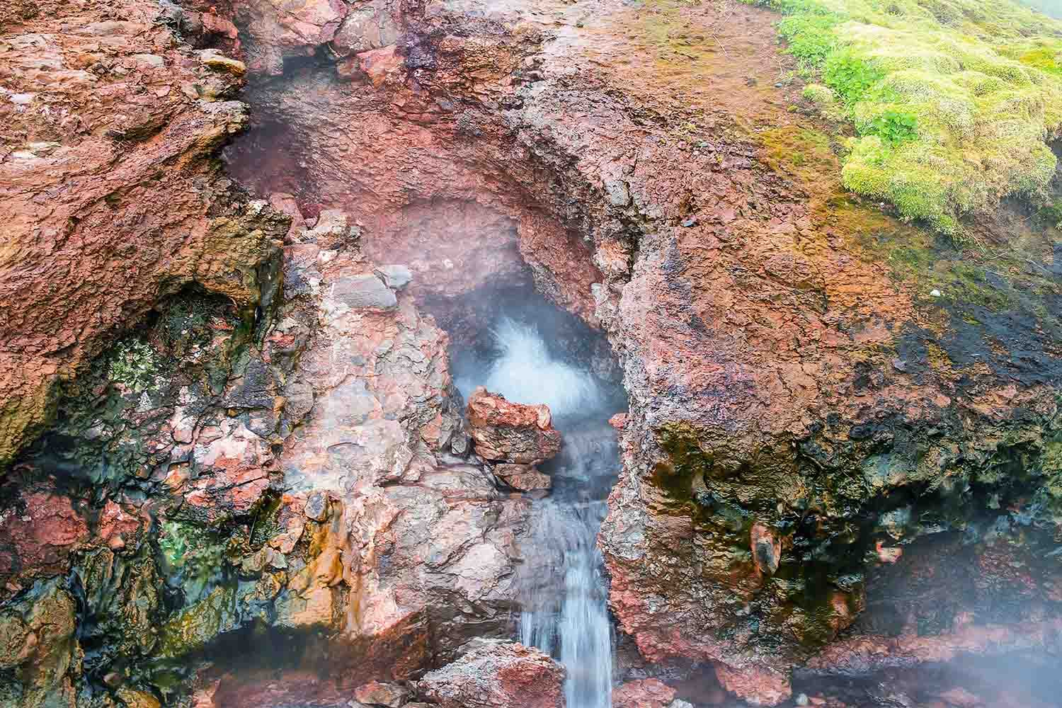 Deildartunguhver-small-waterfall-from-hot-spring