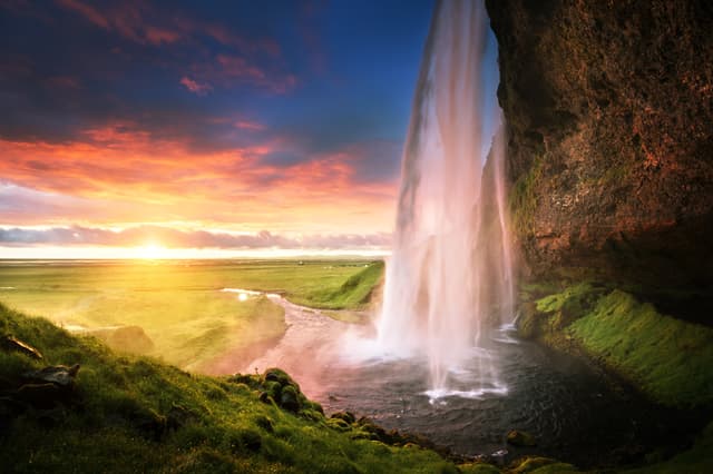 Seljalandsfoss waterfall at sunset, Iceland Seljalandsfoss waterfall at sunset, Iceland