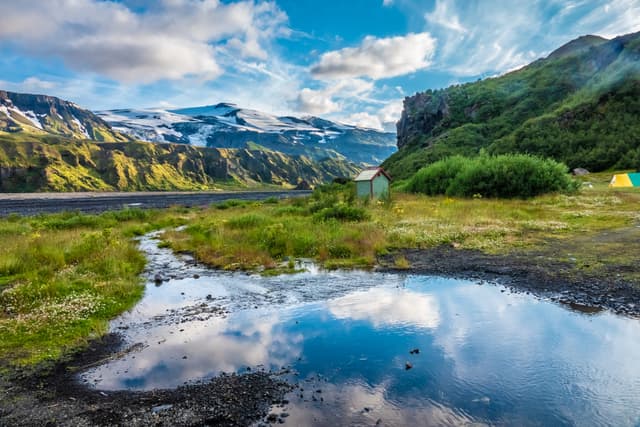 The top of the Eyjafjallajokull glacier and volcano  from Thorsmork in the Highlands of Iceland at southern end of the famous Laugavegur hiking trail. The top of the Eyjafjallajokull glacier and volcano  from Thorsmork in the Highlands of Iceland at southern end of the famous Laugavegur hiking trail.