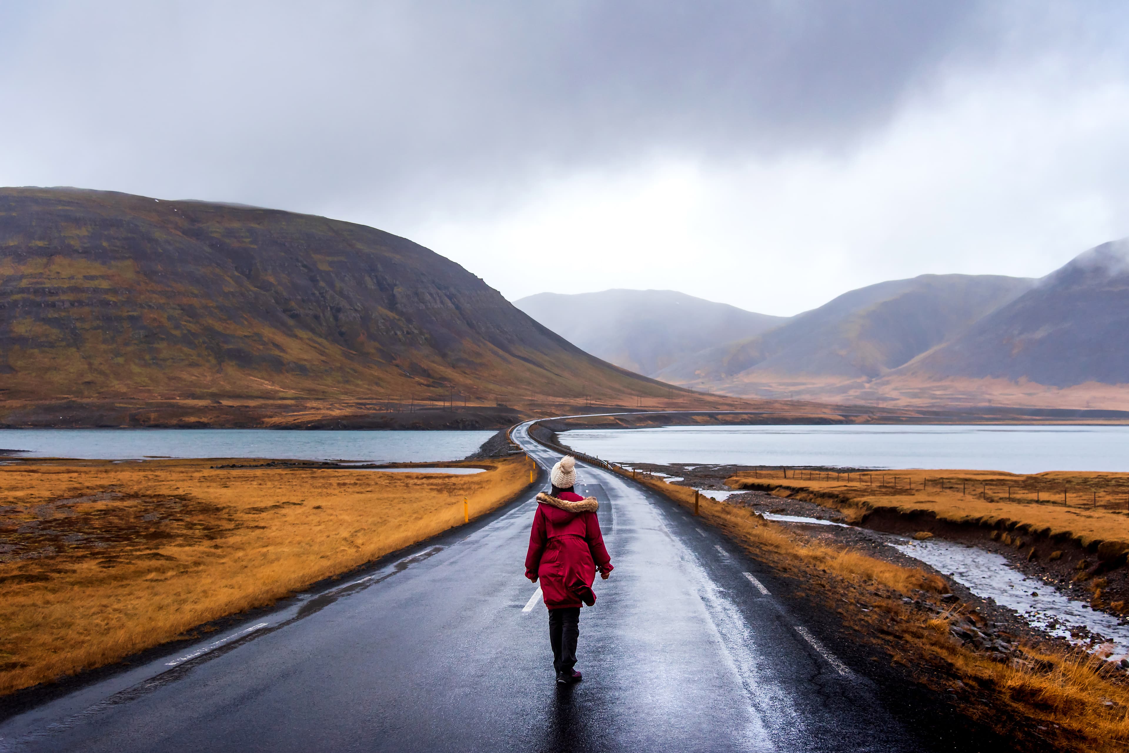 Traveler on scenic Icelandic road in Snaefellsnes peninsula of Iceland Traveler on Icelandic road in Snaefellsnes peninsula of Iceland