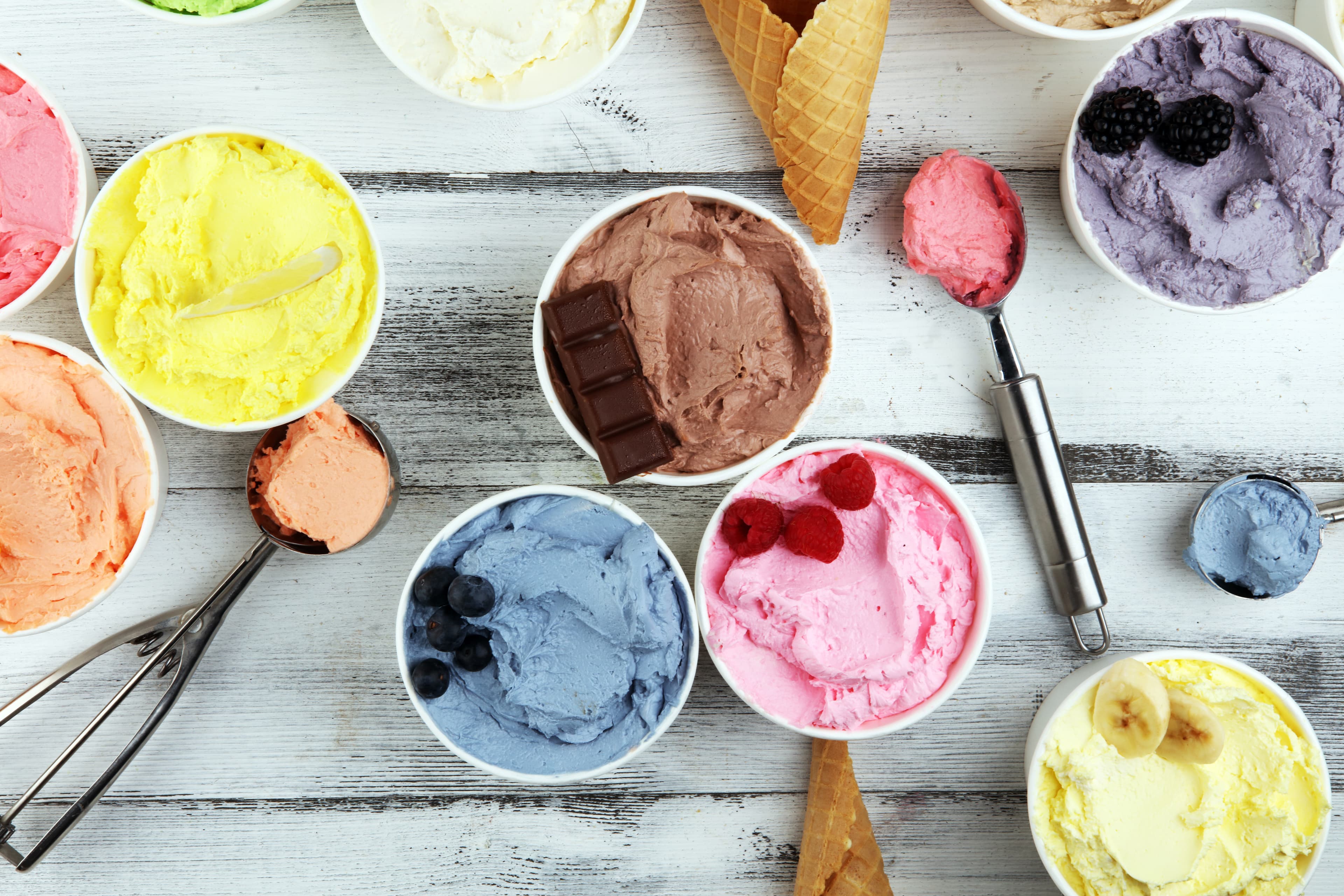 Various of ice cream flavor with fresh blueberry, strawberry, kiwi, lemon, vanilla setup on rustic background . Summer and Sweet ice cream Various of ice cream flavor whit fresh blueberry, strawberry, kiwi, lemon, vanilla setup on rustic background . Summer and Sweet cold ice cream