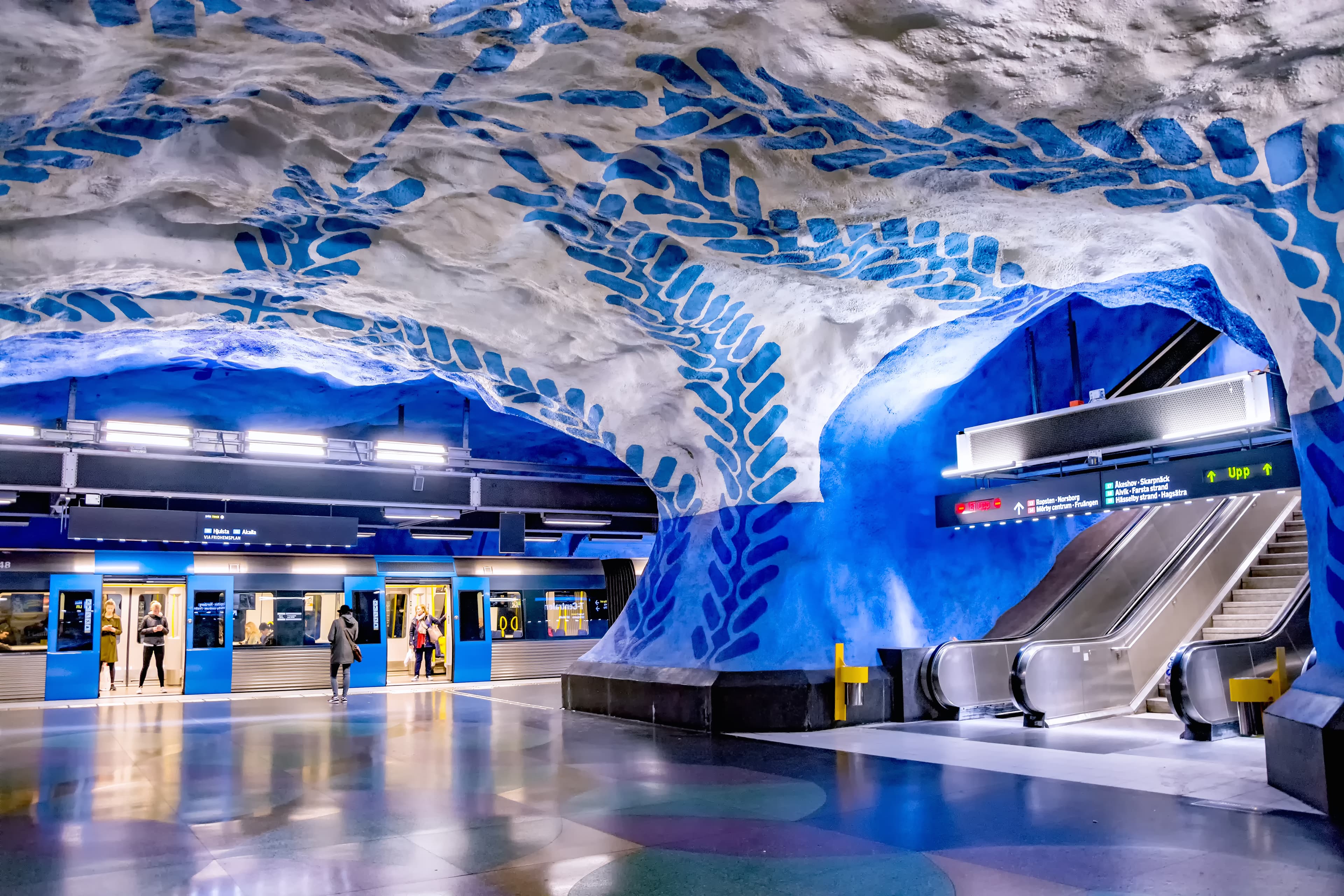 STOCKHOLM, SWEDEN MAY 26, 2019: Interior of the T-Centralen station of the blue subway line in Stockholm, Sweden. Stockholm metro is one of the longest underground art galleries in the world. STOCKHOLM, SWEDEN MAY 26, 2019: Interior of the T-Centralen station of the blue subway line in Stockholm, Sweden. Stockholm metro is one of the longest underground art galleries in the world.