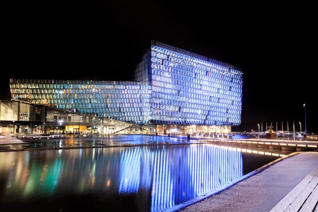 REYKJAVIK, ICELAND - MARCH 26, 2015: Night scene of Harpa Concert Hall in Reykjavik, Iceland. It was opened on May 4, 2013. Night scene of Harpa Concert Hall in Reykjavik