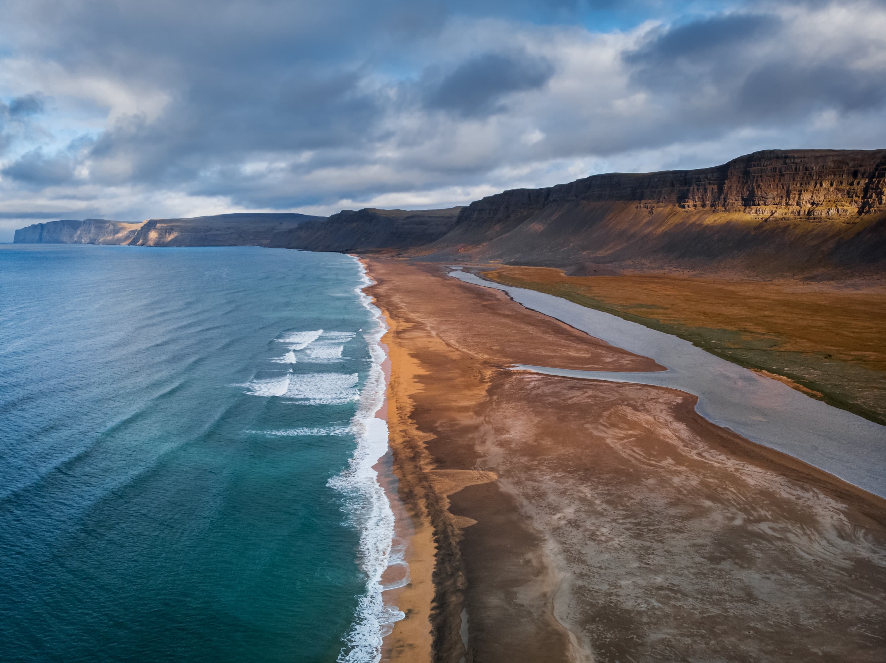 Raudisandur Beach with red sand, aerial view from drone, West Fjords or The Westfjords region in Iceland. Nature landscape from above Raudisandur Beach with red sand, aerial view from drone, West Fjords or The Westfjords region in Iceland. Nature landscape from above