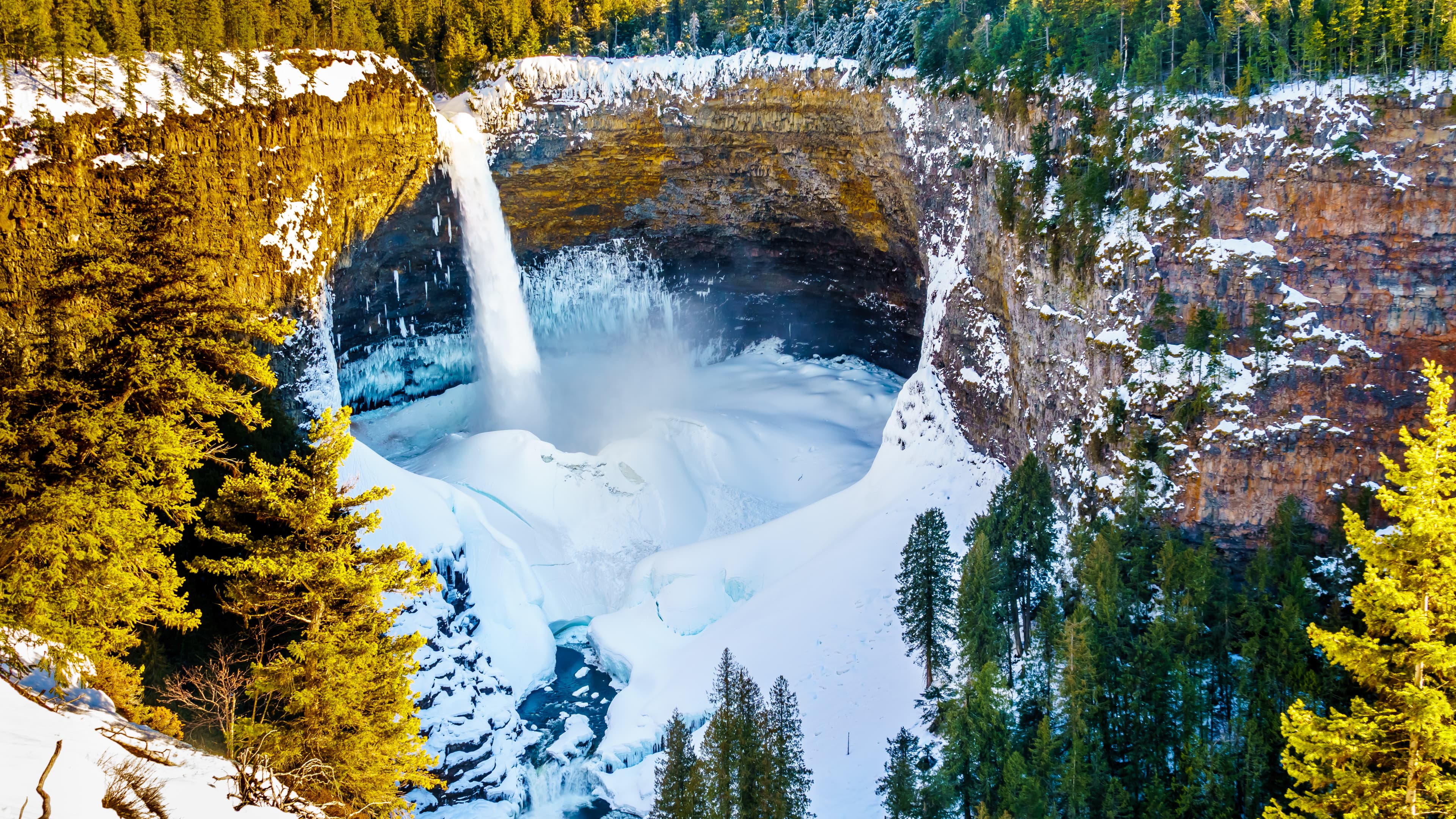 Helmcken Falls on the Murtle River in winter with the spectacular ice and snow cone at the bottom. In Wells Gray Provincial Park near the town of Clearwater, British Columbia, Canada