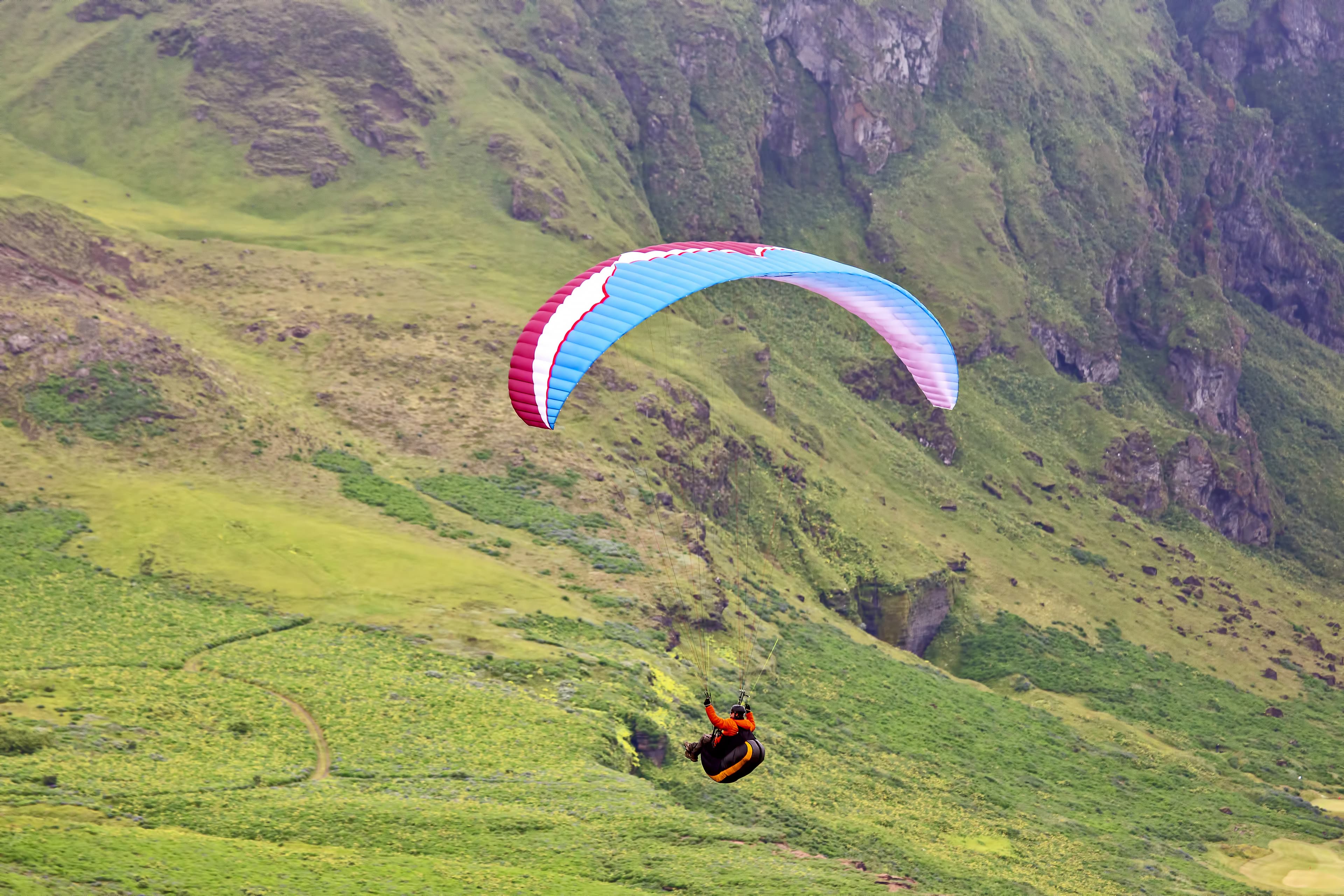 Paraglider flying in Iceland. Nature and places for wonderful travels Paraglider flying in Iceland. Nature and places for wonderful travels