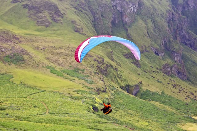 Paraglider flying in Iceland. Nature and places for wonderful travels Paraglider flying in Iceland. Nature and places for wonderful travels