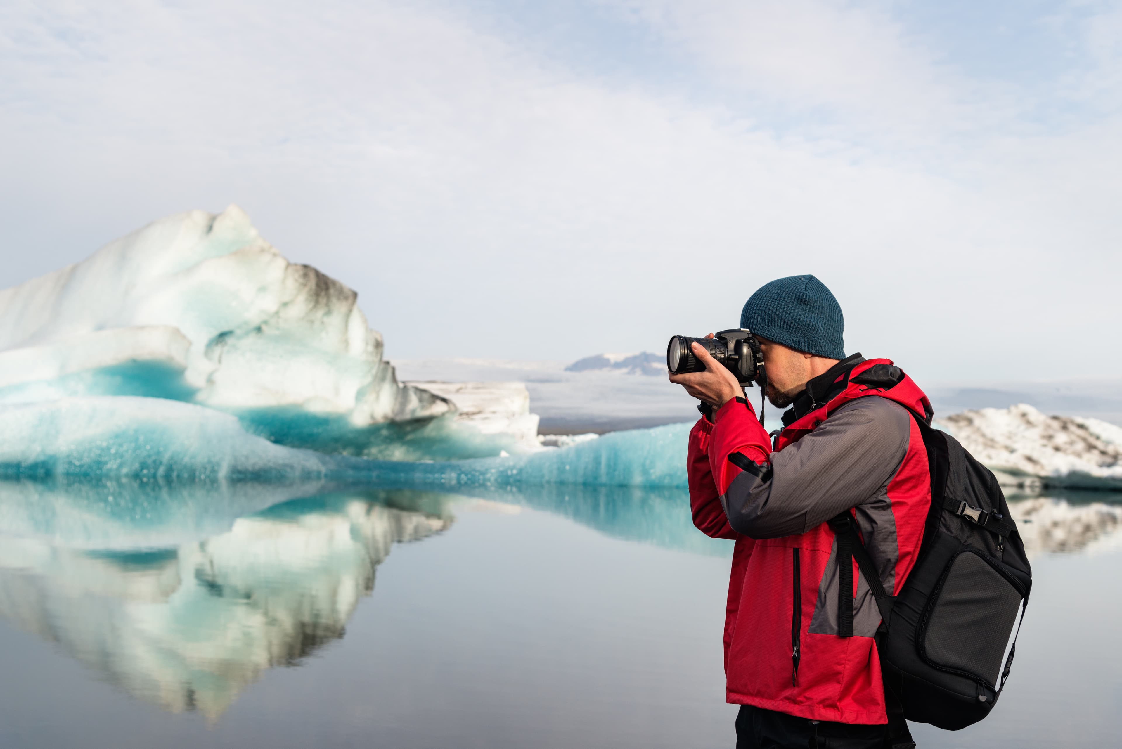 Professional photographer taking picture in Ice Lagoon, Iceland Photographer taking picture in Ice lagoon