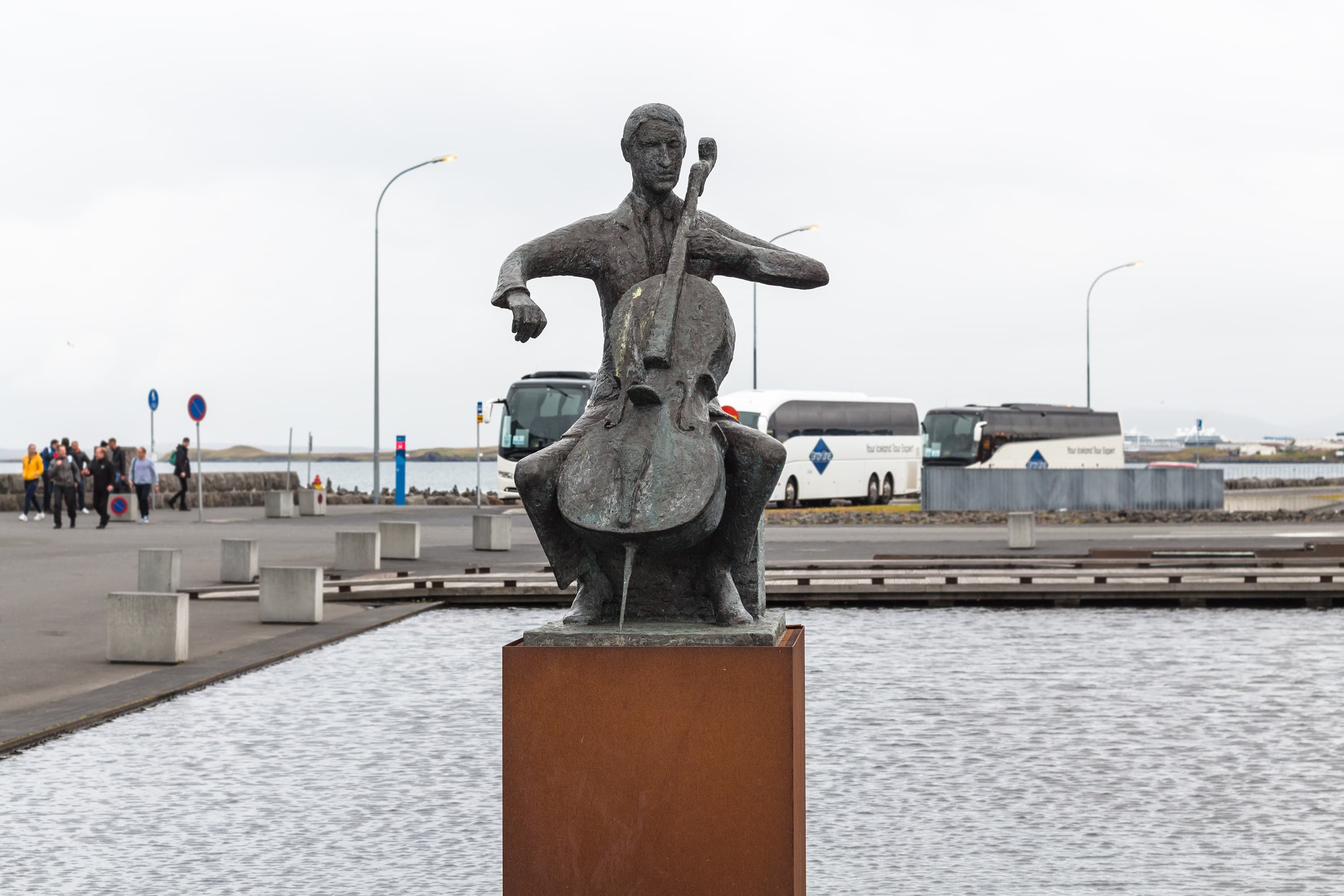 REYKJAVIK, ICELAND - SEPTEMBER 5, 2017: statue of Danish cellist Erling Blondal Bengtsson by Icelandic sculptor Olof Palsdottir near Harpa Concert Hall in Reykjavik city in autumn. REYKJAVIK, ICELAND - SEPTEMBER 5, 2017: statue of Danish cellist Erling Blondal Bengtsson by Icelandic sculptor Olof Palsdottir near Harpa Concert Hall in Reykjavik city in autumn.