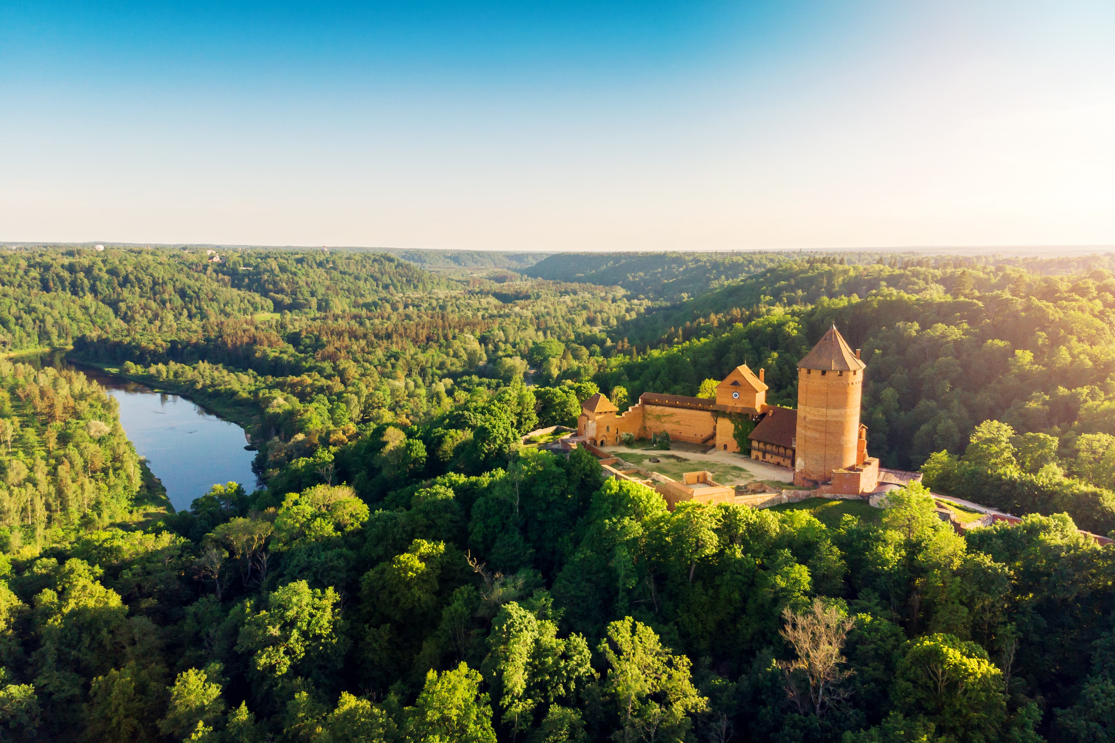 aerial view to the Turaida castle and river Gauja at sunset, Latvia aerial view to the Turaida castle and river Gauja at sunset, Latvia