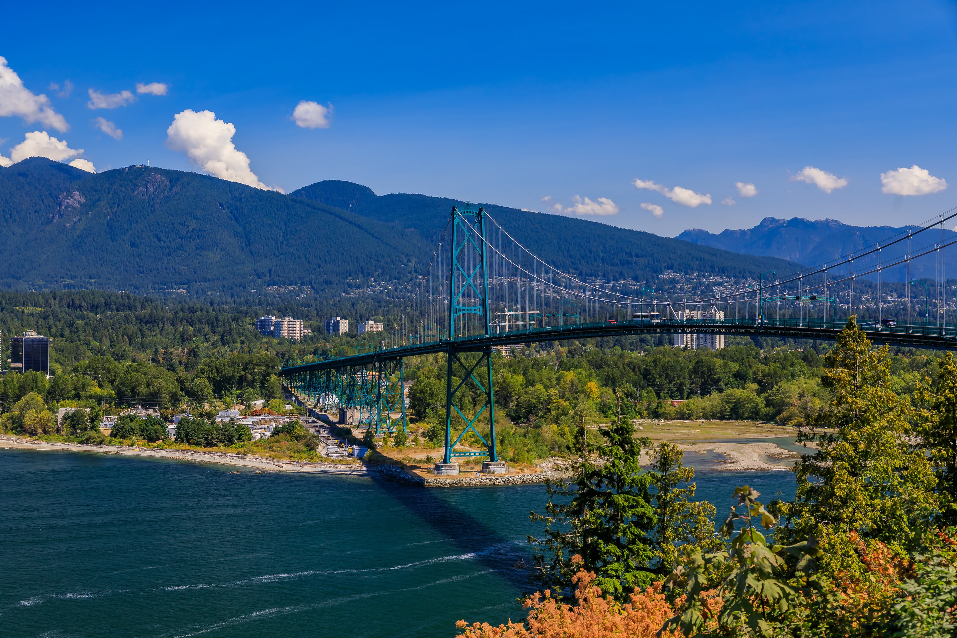 Lions Gate Suspension Bridge or First Narrows Bridge in Stanley Park Vancouver Canada with North Vancouver and mountains in the background Vancouver & North Vancouver Full-Day Tour 3