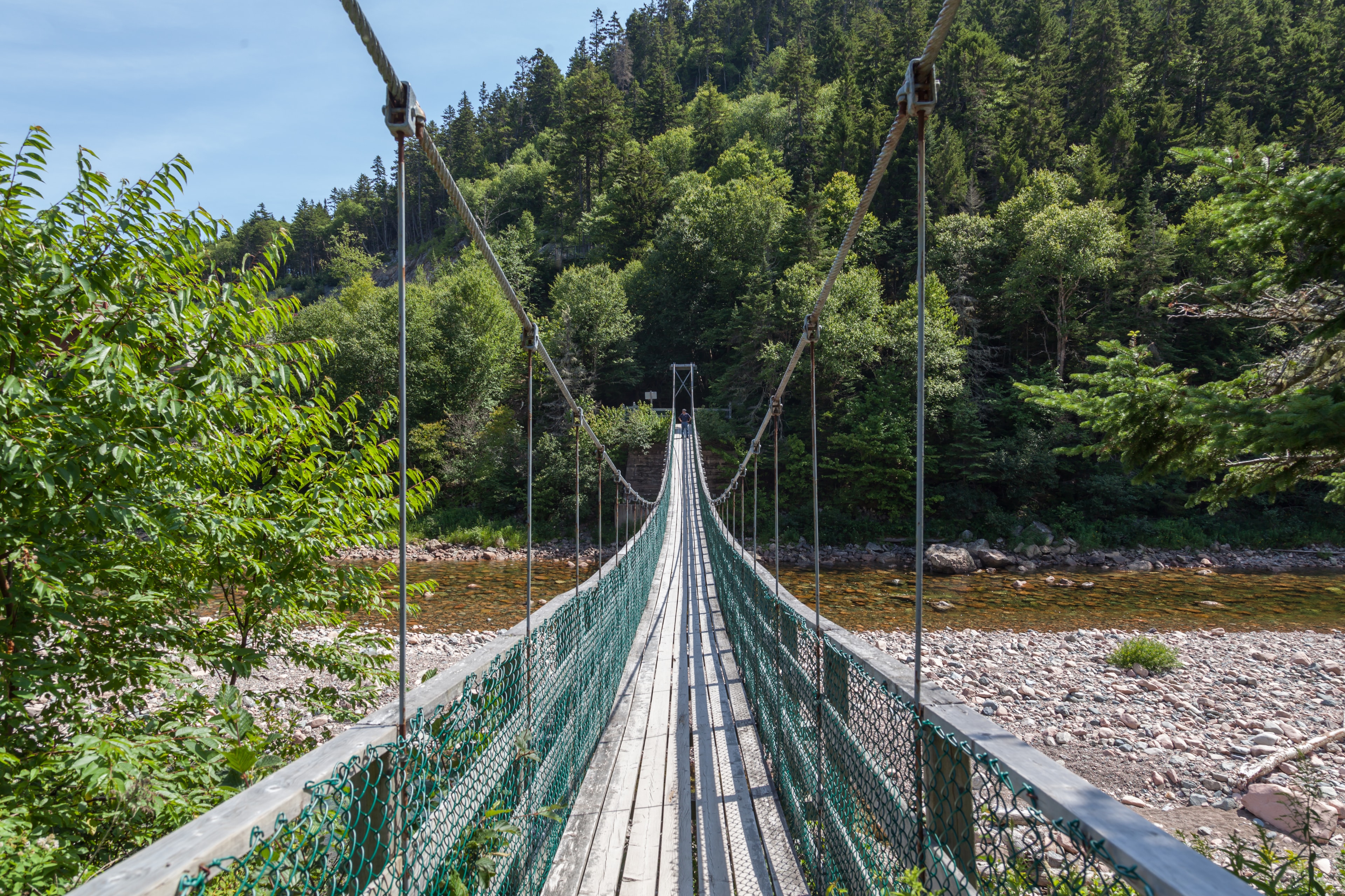 NEW  BRUNSWICK, CANADA - August 4, 2017: Suspension bridge crossing the Salmon River in the Fundy National Park New Brunswick Canada.