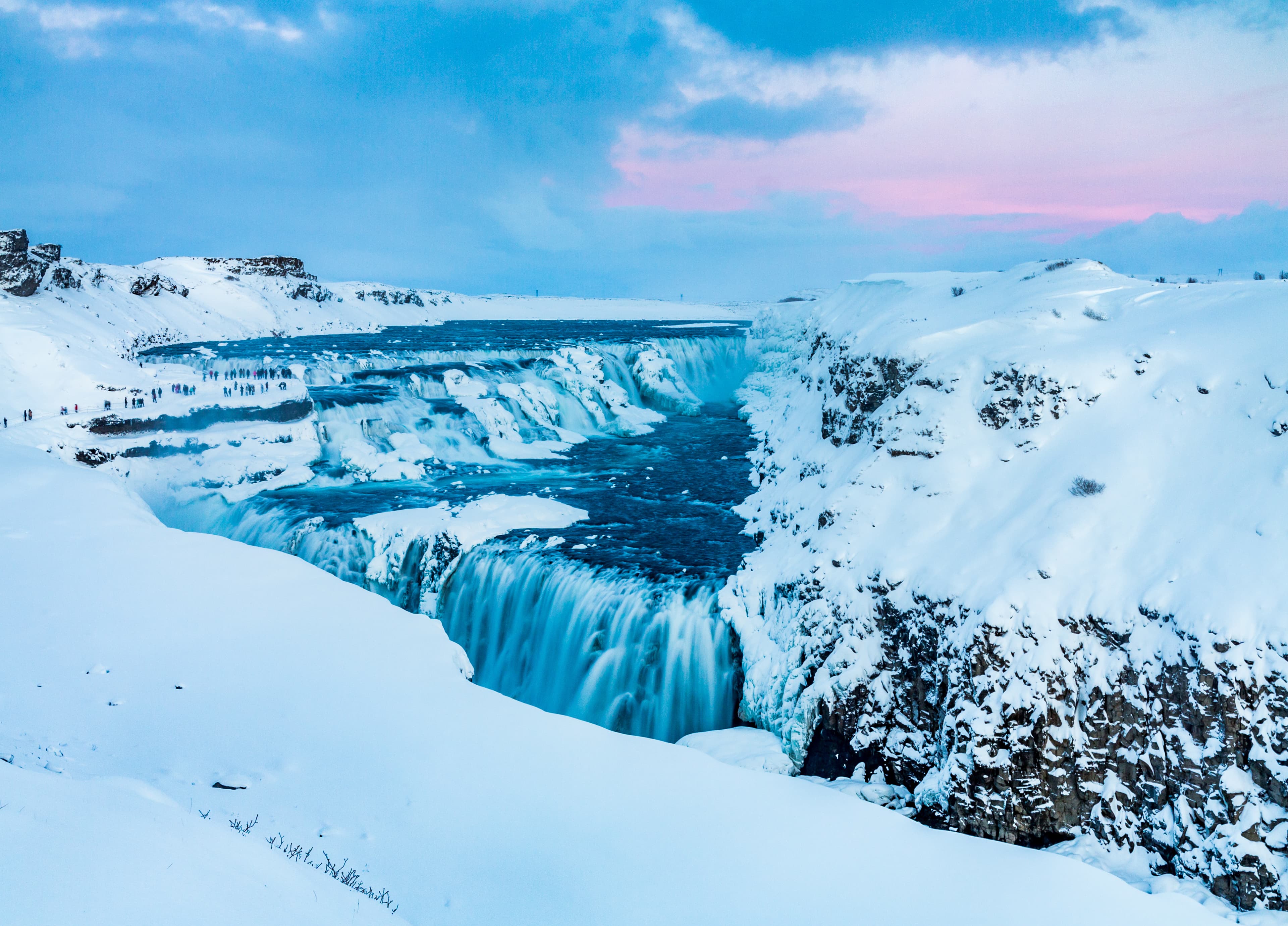 Gulfoss Waterfall of the Golden Circle in heavy snow in Iceland at sunset Gulfoss Waterfall in the snow at sunset