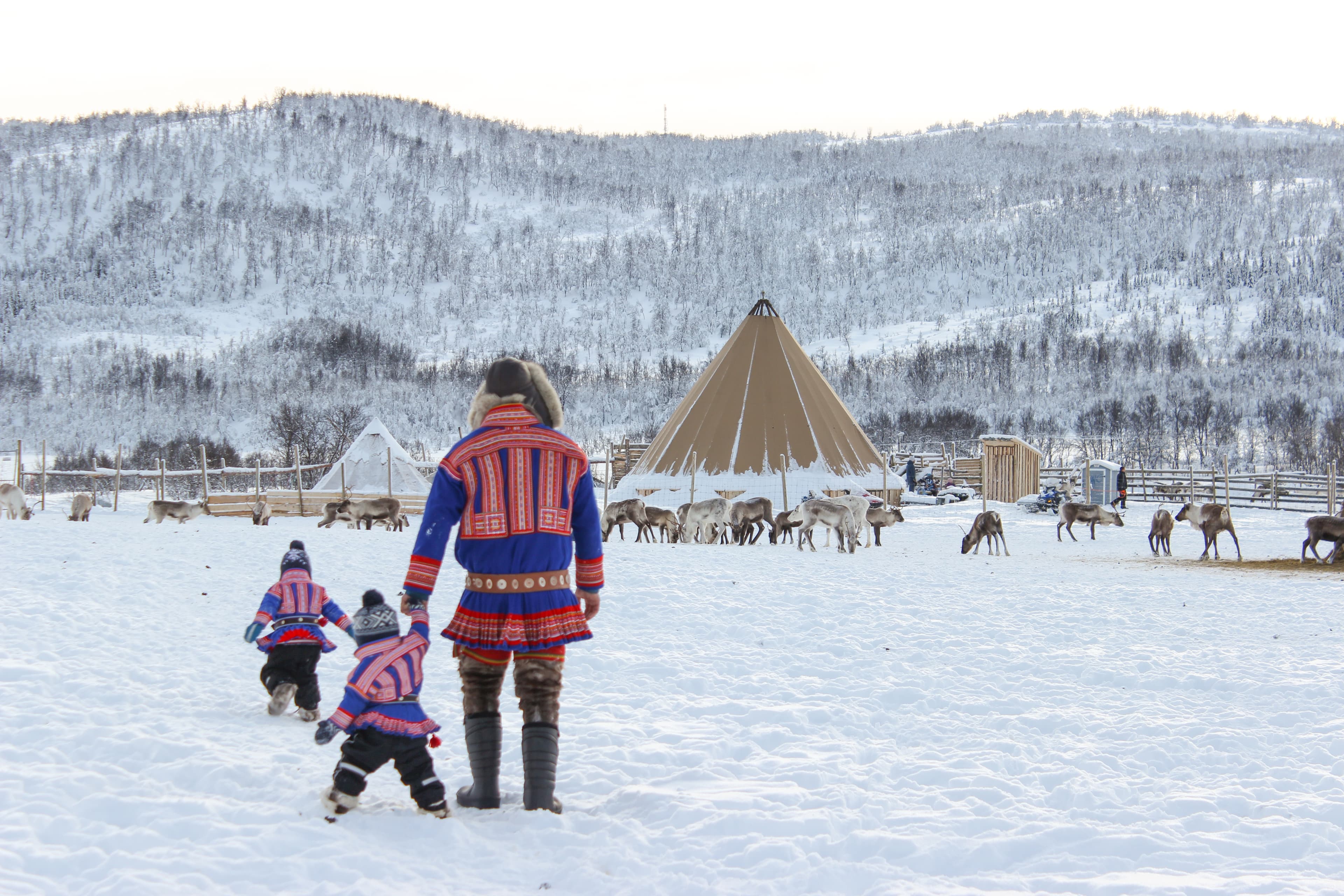 Man-with-children-by-campsite-in-Norway
