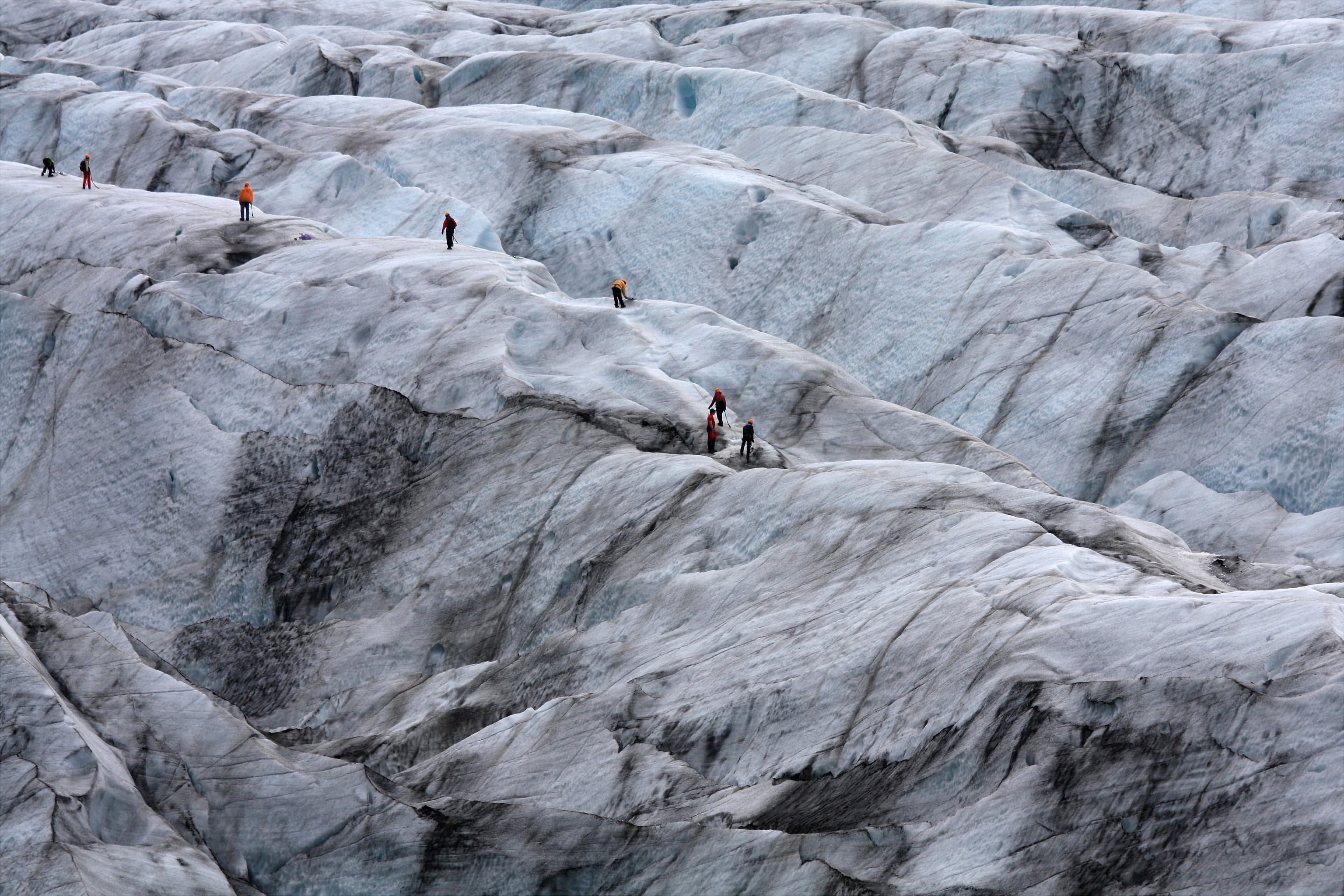 group-of-people-hiking-on-glacier-in-iceland