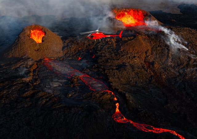 Eruption, Craters, Lava in Geldingadalur, Reykjanes Helicopter-flying-above-Volcano-eruption