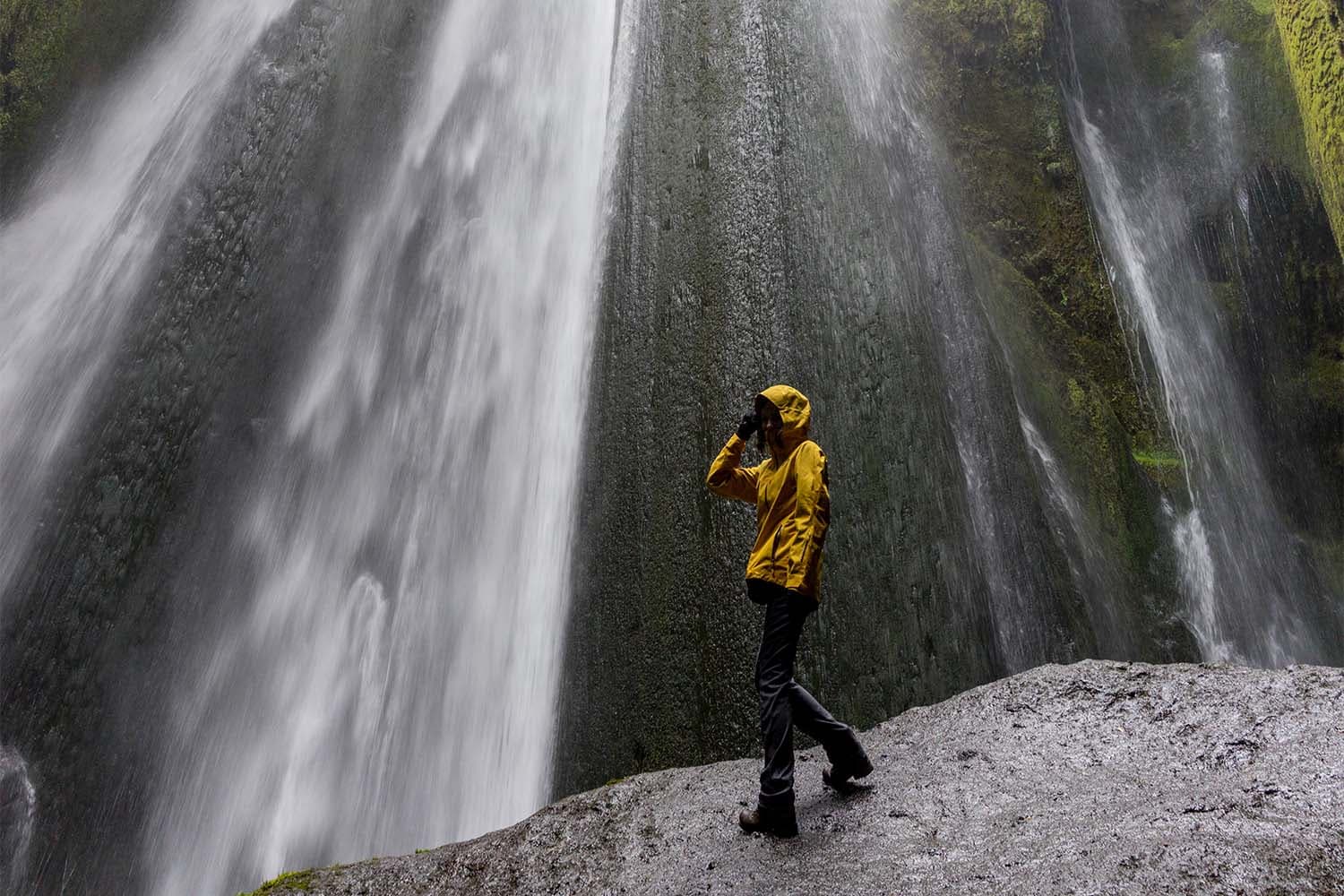 woman-standing-near-waterfall-in-iceland