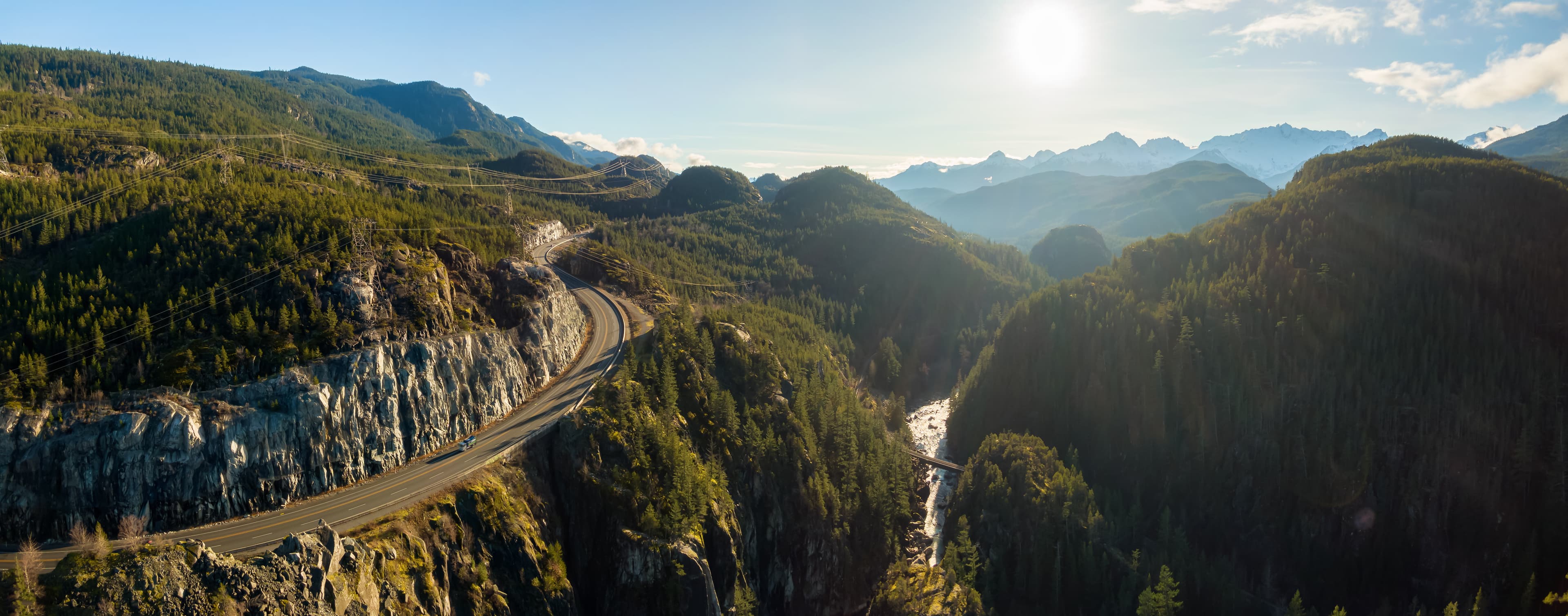 Aerial Panoramic View of the Famous Scenic Drive, Sea to Sky Highway, during a sunny evening before sunset. Located between Squamish and Whistler, North of Vancouver, British Columbia, Canada. Aerial Panoramic View of the Famous Scenic Drive in Whistler
