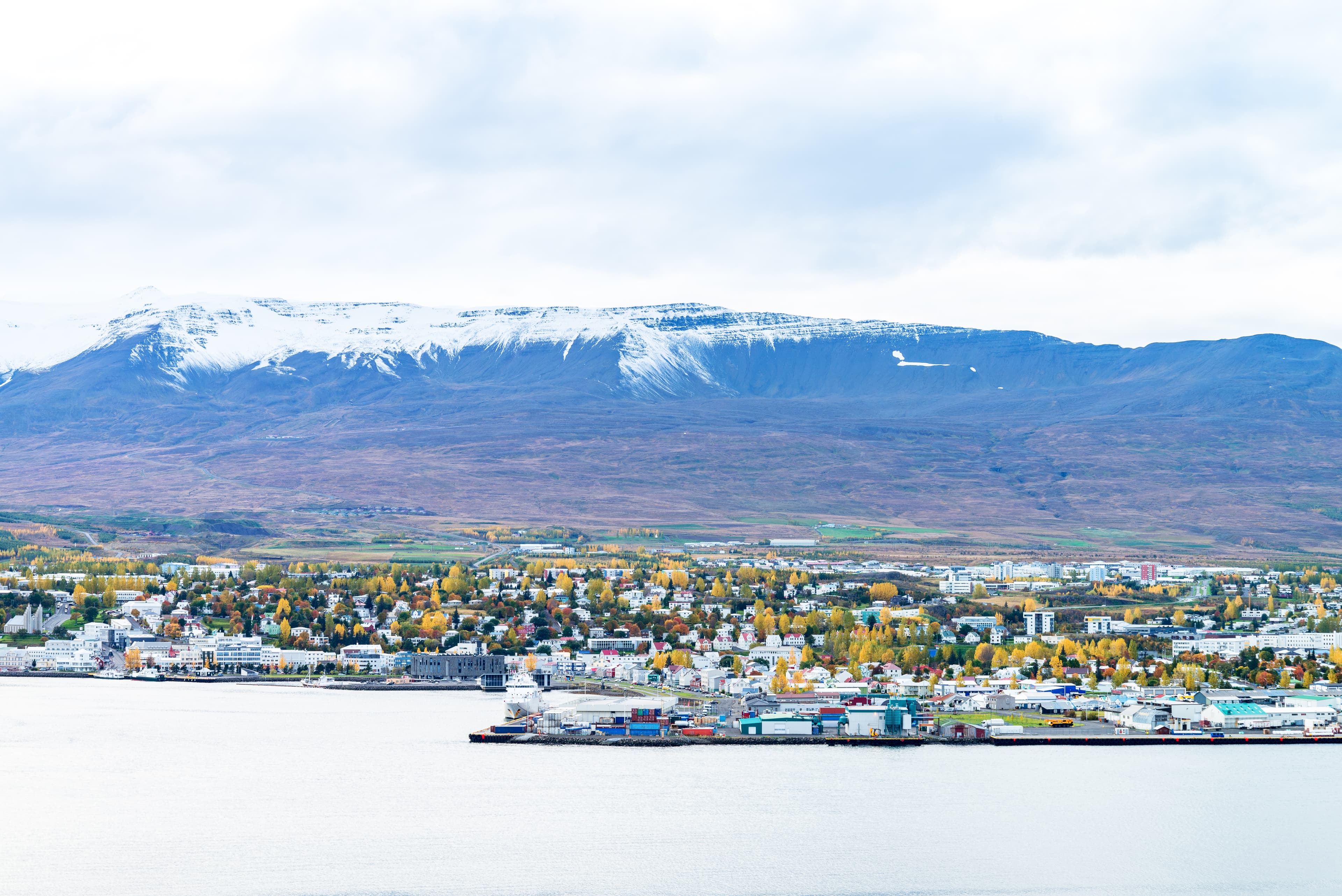 Beautiful scenery of Akureyri city from tourist viewpoint across the sea and Eyjafjordur fjord in iceland