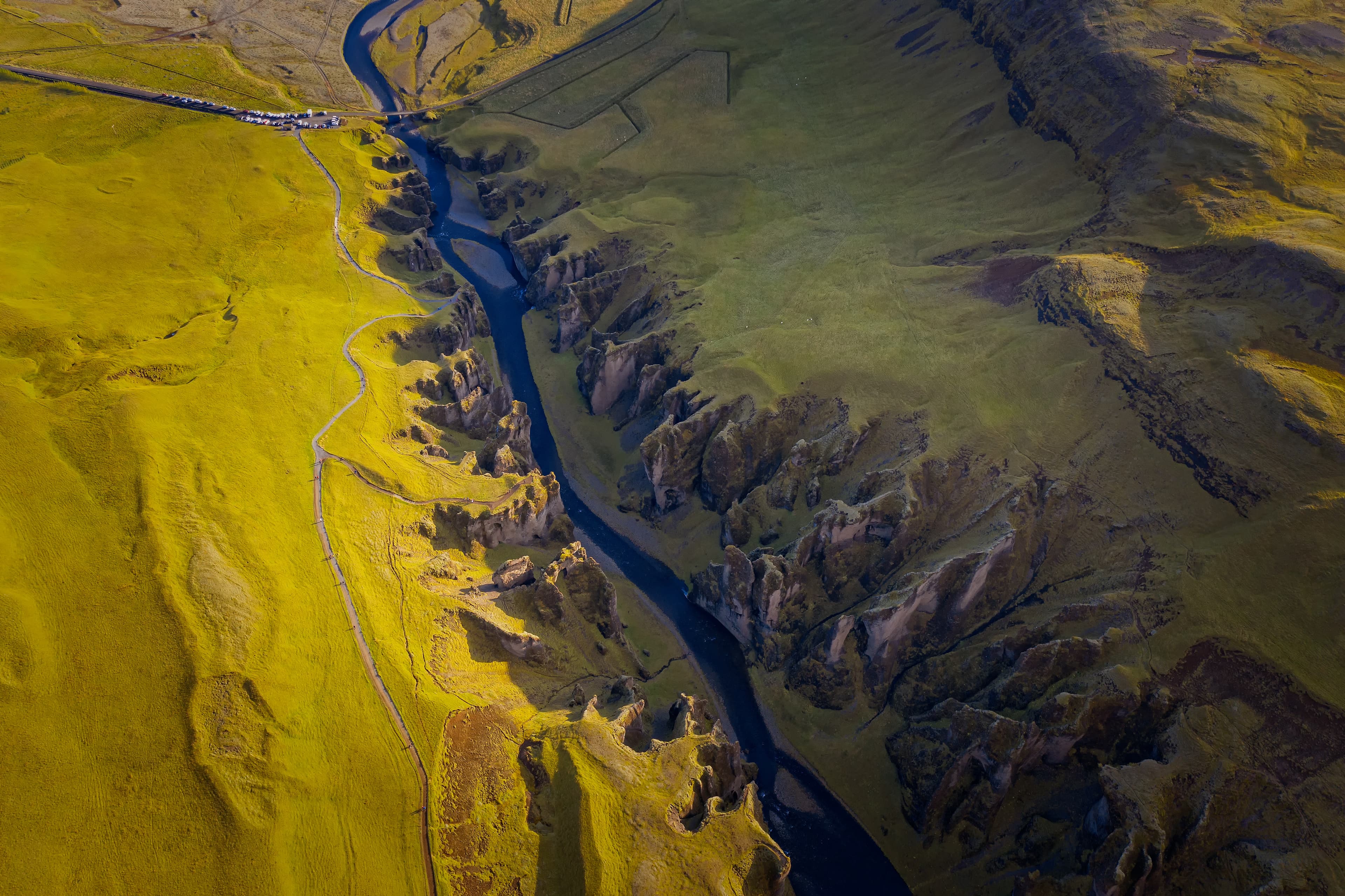 The most picturesque canyon Fjadrargljufur and the shallow creek, which flows along the bottom of the canyon. Fantastic country Iceland. September 2019. aerial drone shot The most picturesque canyon Fjadrargljufur and the shallow creek, which flows along the bottom of the canyon. Fantastic country Iceland. September 2019. aerial drone shot